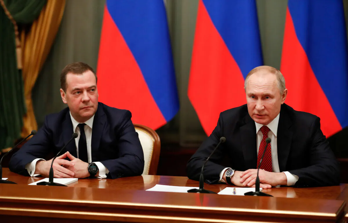 Russian President Vladimir Putin (R) and deputy security council chief Dmitry Medvedev attend a meeting with members of the government in Moscow, Russia, on Jan. 15, 2020. (Sputnik/Dmitry Astakhov/Pool via Reuters/File Photo)