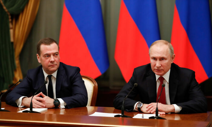Russian President Vladimir Putin (R) and deputy security council chief Dmitry Medvedev attend a meeting with members of the government in Moscow, Russia, on Jan. 15, 2020. (Sputnik/Dmitry Astakhov/Pool via Reuters/File Photo)