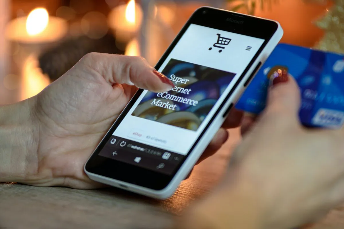 Stock photo of an online shopping website on a mobile phone. (PhotoMIX Company/Pexels)