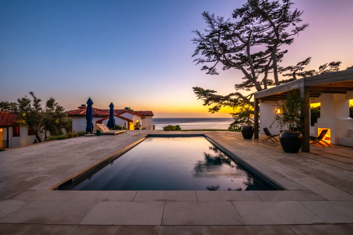 Sunrise and sunset bathe these hillsides and the beaches below in an indescribable ambiance. Here, the main pool reflects a welcoming sunset. (Courtesy of Jade Mills)