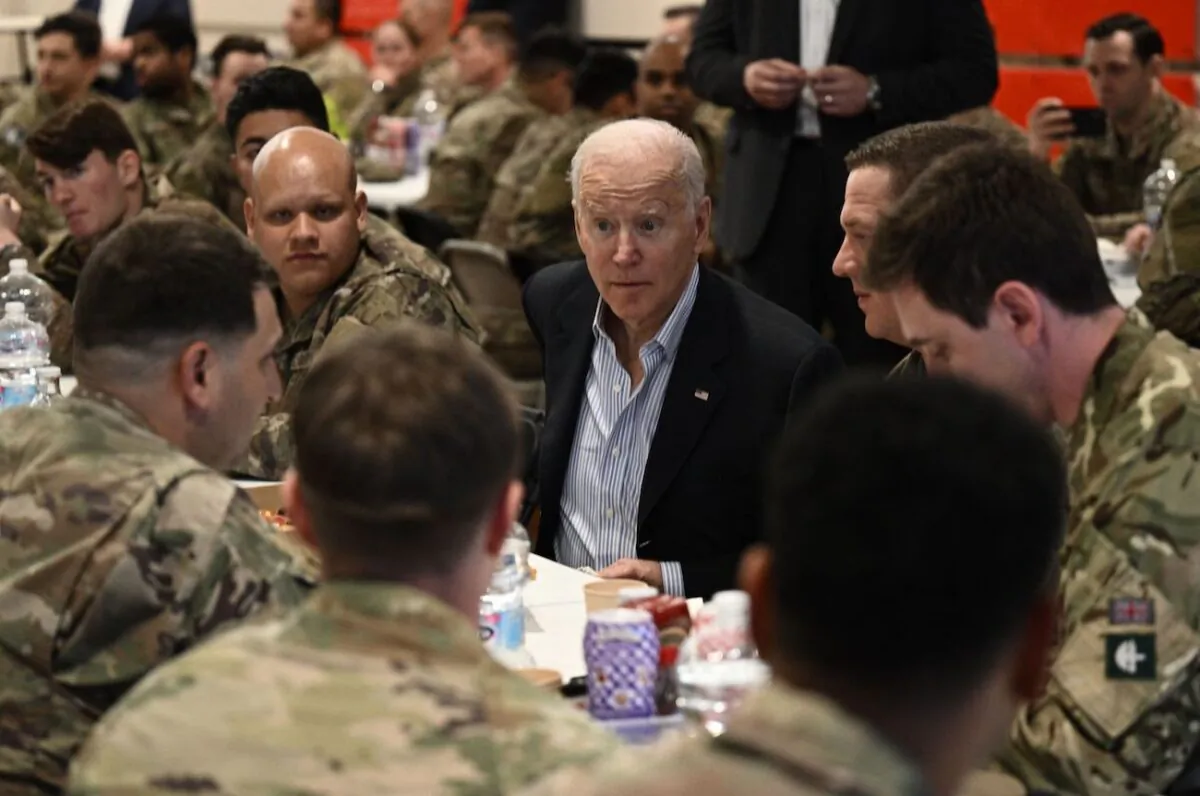 President Joe Biden meets service members from the 82nd Airborne Division, who are contributing alongside Polish Allies to deterrence on the Alliances Eastern Flank, in the city of Rzeszow in southeastern Poland, on March 25, 2022. (Brendan Smialowski/AFP via Getty Images)