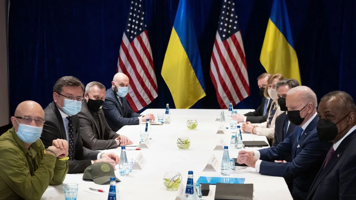 President Joe Biden (2nd R), together with U.S. Secretary of State Antony Blinken (3rd R) and U.S. Defence Secretary Lloyd Austin (R), attend a meeting on Russia's war in Ukraine with Ukrainian Foreign Minister Dmytro Kuleba (2nd L) and Ukrainian Defence Minister Oleksii Reznikov (L) in Warsaw, Poland, on March 26, 2022. (Brendan Smialowski/AFP via Getty Images)