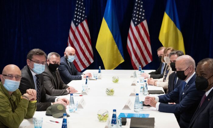 President Joe Biden (2nd R), together with U.S. Secretary of State Antony Blinken (3rd R) and U.S. Defence Secretary Lloyd Austin (R), attend a meeting on Russia's war in Ukraine with Ukrainian Foreign Minister Dmytro Kuleba (2nd L) and Ukrainian Defence Minister Oleksii Reznikov (L) in Warsaw, Poland, on March 26, 2022. (Brendan Smialowski/AFP via Getty Images)
