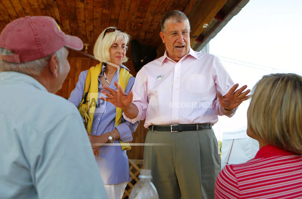 Former independent gubernatorial candidate Eliot Cutler campaigns with his wife, Melanie Cutler on Aug. 13, 2010, in Topsham, Maine. Maine State Police have executed search warrants at two homes belonging to Cutler. (AP Photo/Robert F. Bukaty, File)