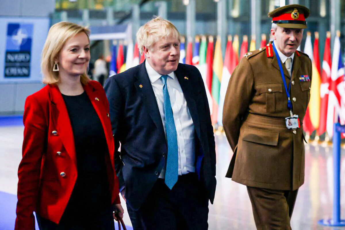 Britain's Prime Minister Boris Johnson (C) Britain's Foreign Secretary Liz Truss (L) and Britain's military representative to NATO Ben Bathurst (R) leave NATO Headquarters following a summit in Brussels on March 24, 2022. (Henry Nicholls /Pool/AFP via Getty Images)