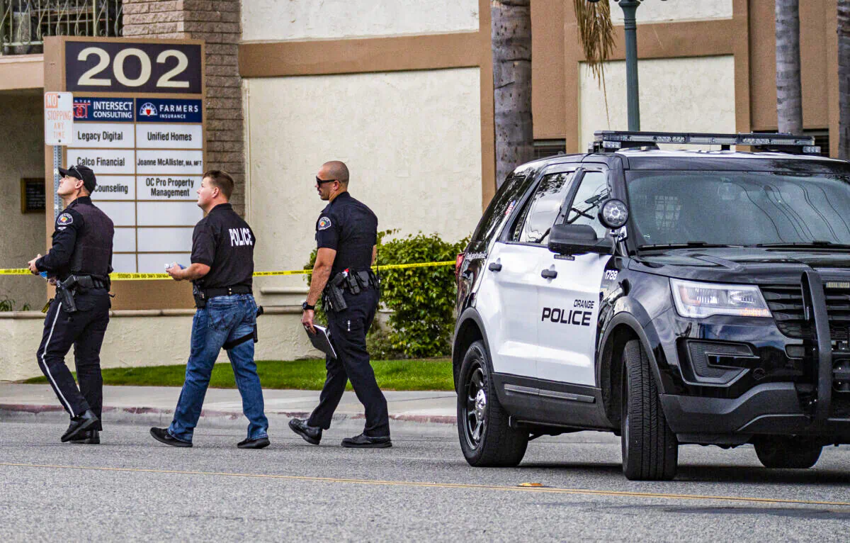 Orange Police monitor a crime scene in Orange, Calif., on April 1, 2021. (John Fredricks/The Epoch Times)