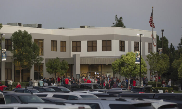 In this file photo, parents gather at the Placentia Yorba Linda Unified School District building in Placentia, Calif., on Oct. 12, 2021. (John Fredricks/The Epoch Times)