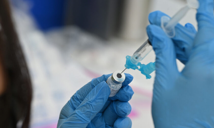 A health care worker fills a syringe with Pfizer's COVID-19 vaccine in a file image. (Robyn Beck/AFP via Getty Images)