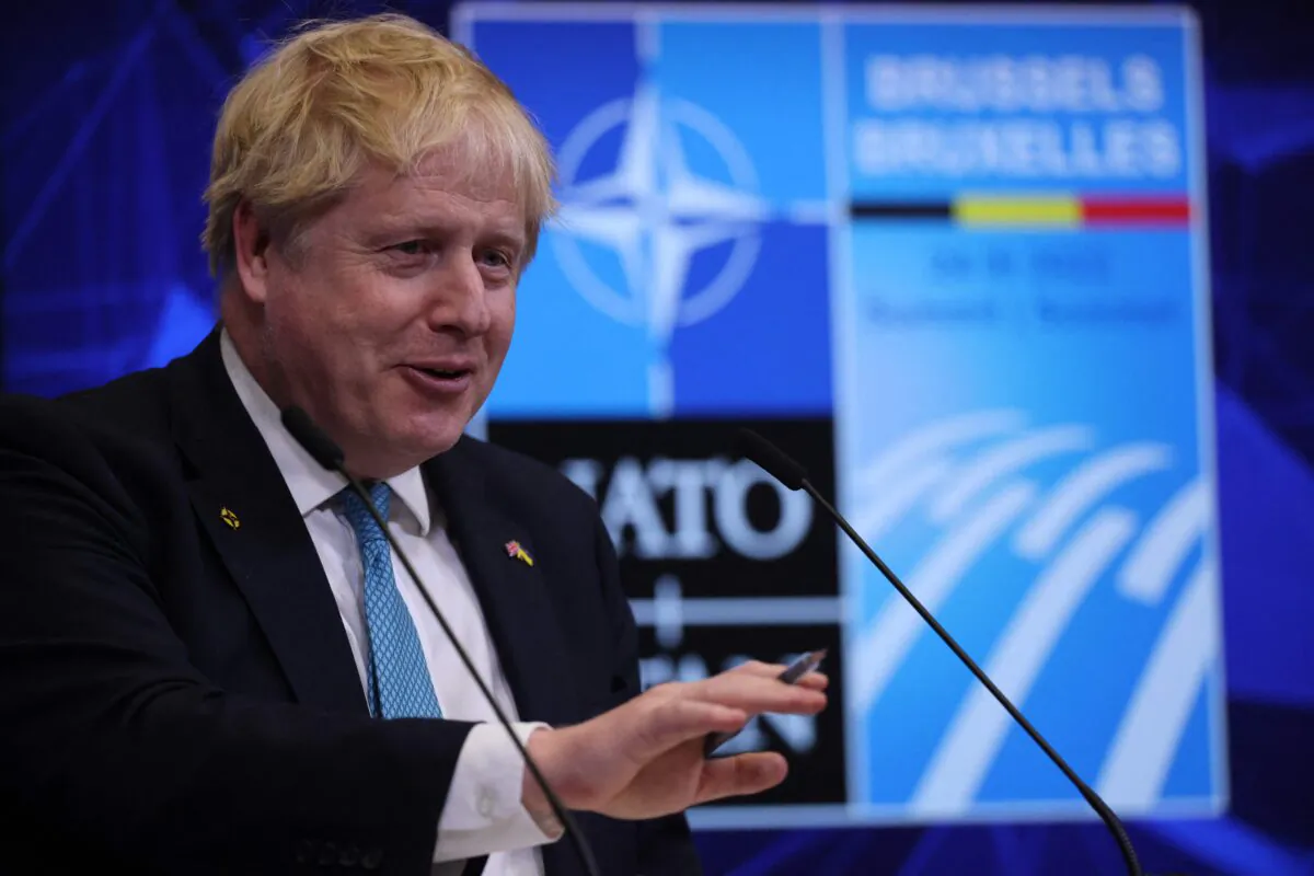 Britain's Prime Minister Boris Johnson speaks during a press conference at NATO Headquarters in Brussels, on March 24, 2022. (Thomas Coex/AFP via Getty Images)