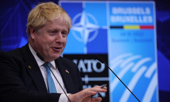 Britain's Prime Minister Boris Johnson speaks during a press conference at NATO Headquarters in Brussels, on March 24, 2022. (Thomas Coex/AFP via Getty Images)