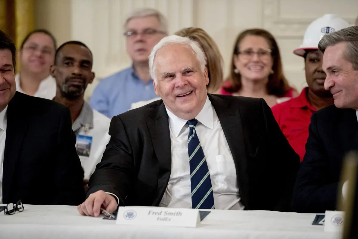 FedEx CEO Fred Smith (C) appears at a signing ceremony where President Donald Trump signed an Executive Order that establishes a National Council for the American Worker, in the East Room of the White House on July 19, 2018. (Andrew Harnik/AP Photo)