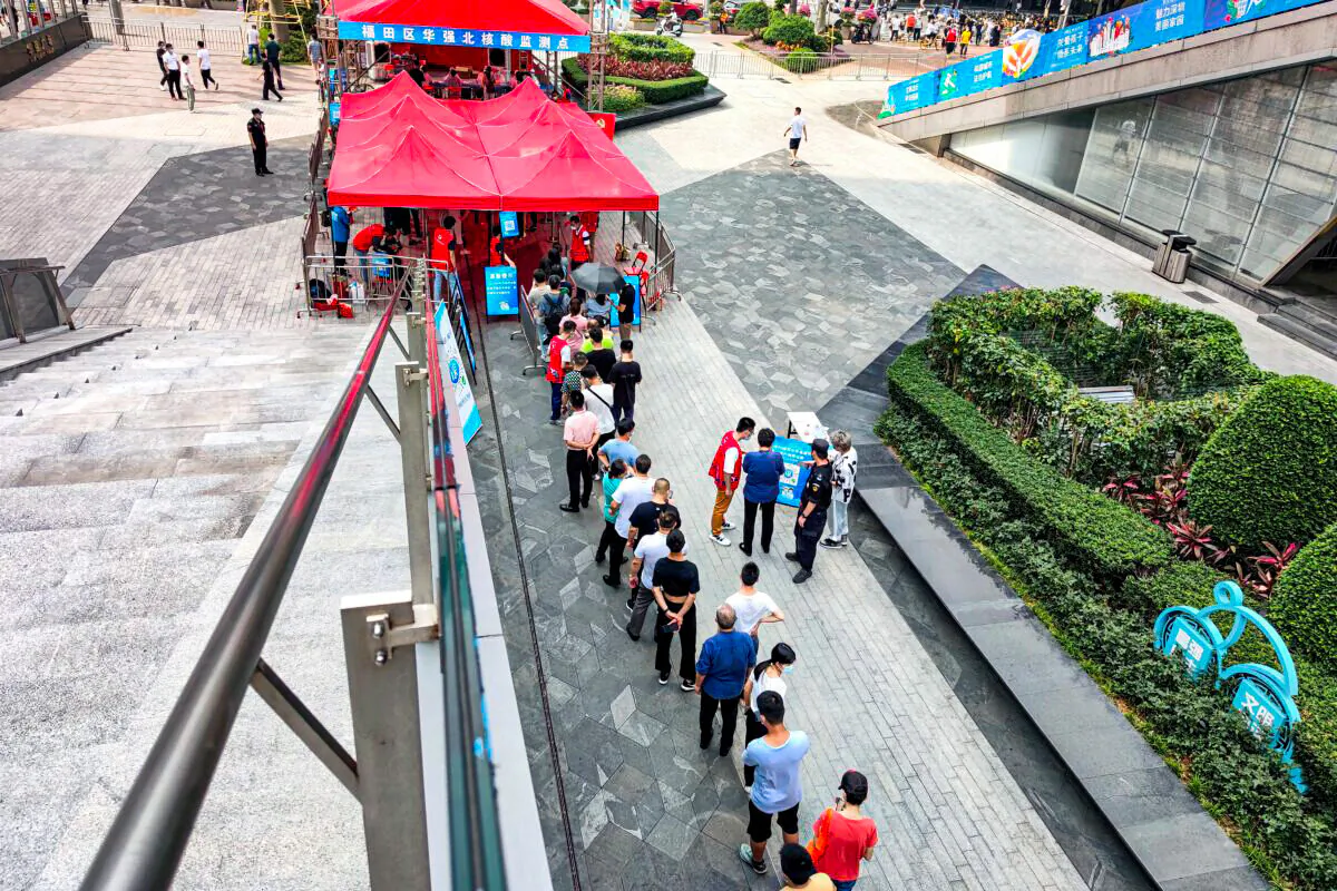 People are taking the COVID-19 test in Shenzhen, in China's southern Guangdong Province, on June 6, 2021. (STR/AFP via Getty Images)