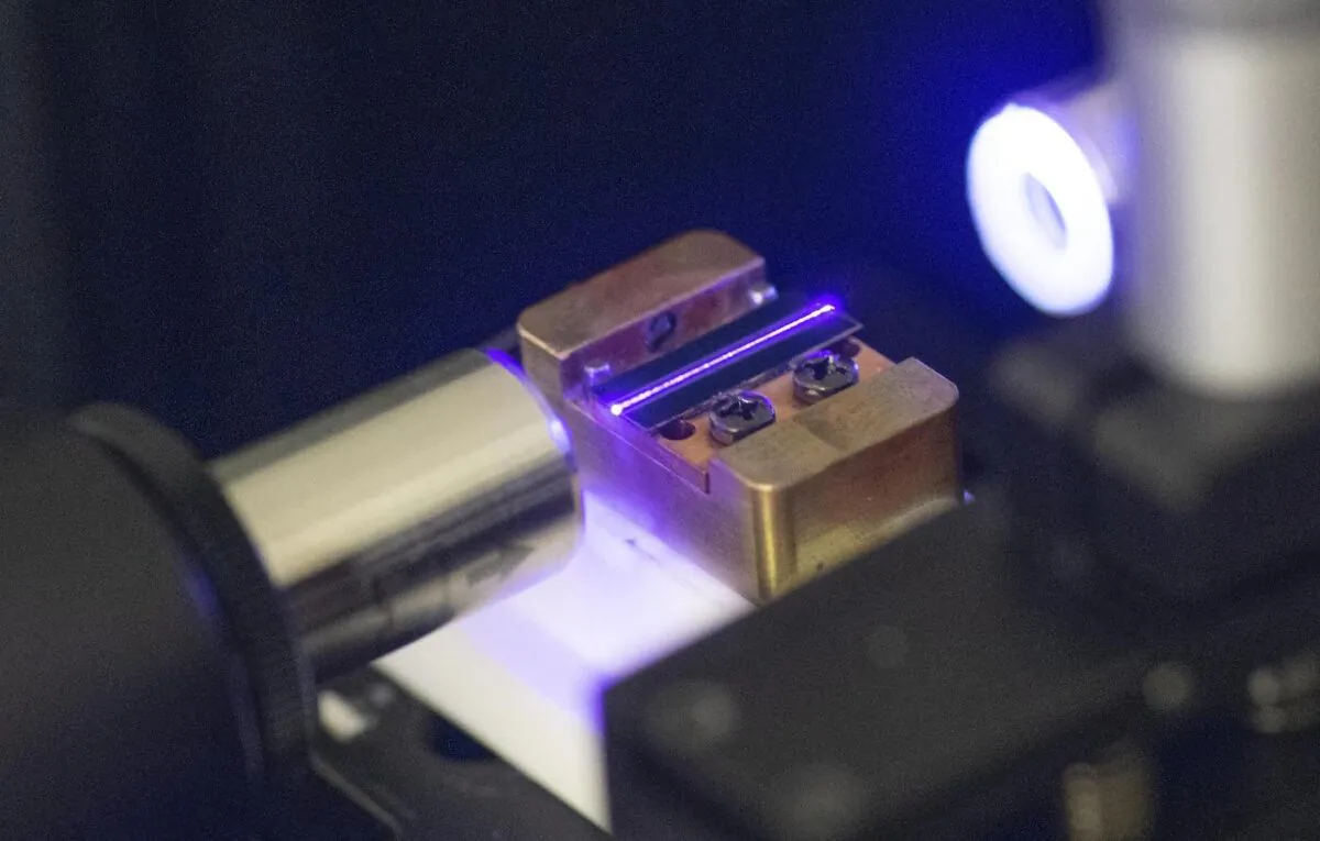 A laser tests the optical waveguide of a chip for quantum computing in a laboratory in Stuttgart, southern Germany, on Sept. 14, 2021. (Thomas Kienzle/AFP via Getty Images)