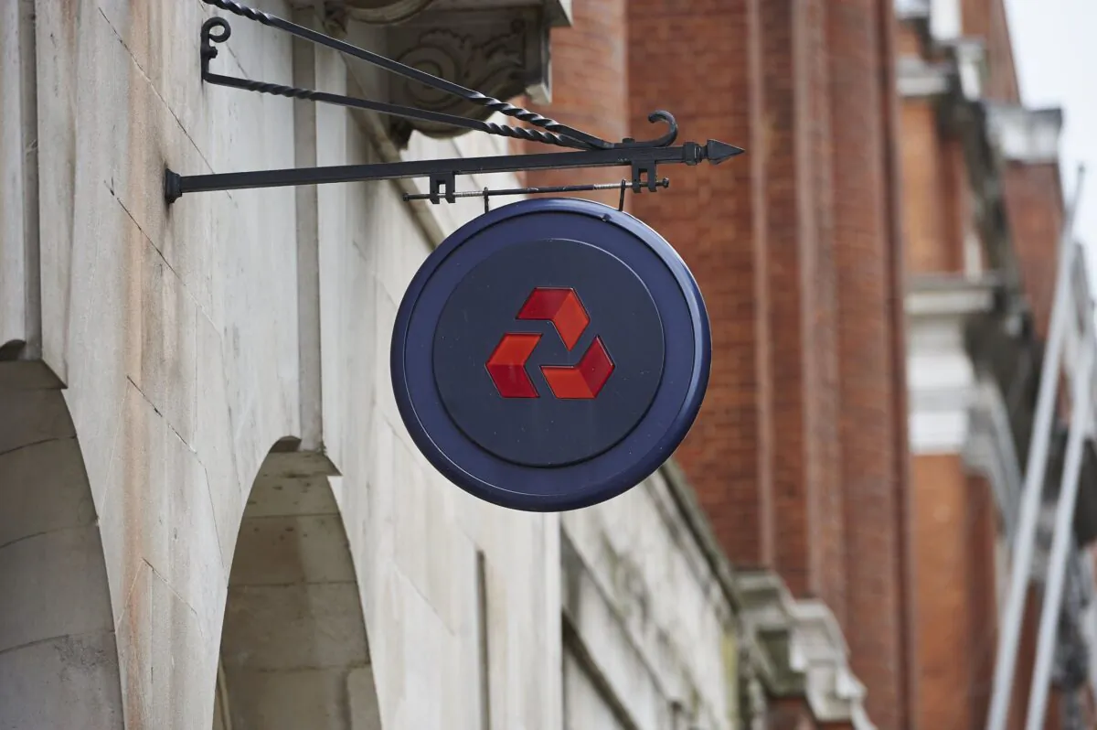 The NatWest logo hangs from the facade of a NatWest bank branch in central London, on July 17, 2015. (Niklas Halle’n/AFP via Getty Images)