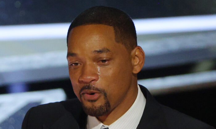 Will Smith cries as he accepts the Oscar for Best Actor in "King Richard" at the 94th Academy Awards in Hollywood, Los Angeles, Calif., on March 27, 2022. (Brian Snyder/Reuters)