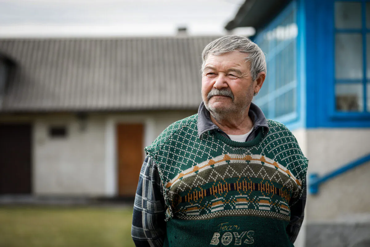 Viktor Pokrovskaya in his front yard in Koty, Ukraine, on March 25, 2022. (Charlotte Cuthbertson/The Epoch Times)