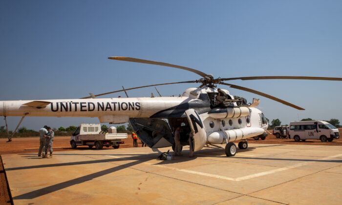A United Nations (UN) helicopter, operated by the United Nations Multidimensional Integrated Stabilization Mission in Central African Rrepiblic (MINUSCA) staff which is flown for short distances due to the threat of explosive devices, lands in Paoua, on Dec. 2, 2021.  (Barbara Debout/AFP via Getty Images)