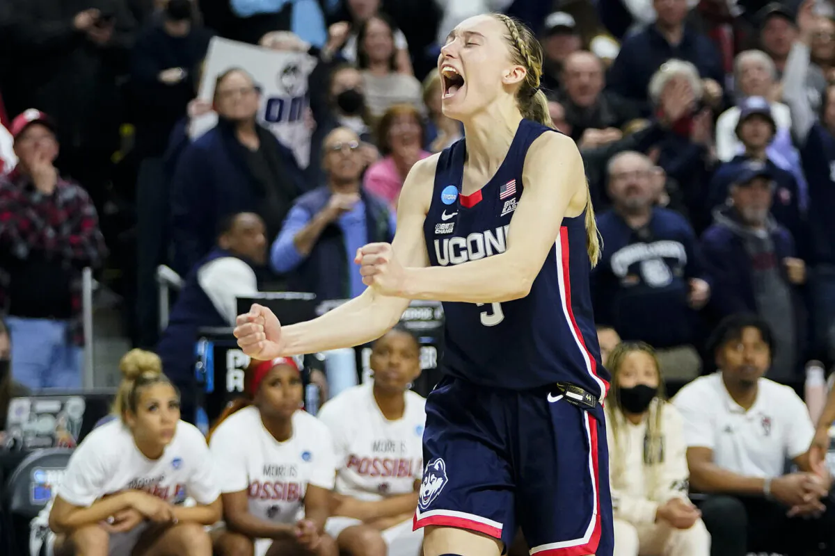Connecticut guard Paige Bueckers (5) reacts in double overtime against NC State during the East Regional final college basketball game of the NCAA women's tournament in Bridgeport, Conn., on March 28, 2022, (Frank Franklin II/AP Photo)