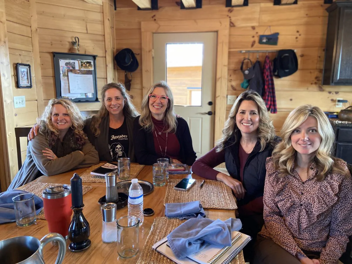 (L–R) Melodi Fentress, Aryn Schloemer, Bronni VanDerwerker, Mindy Sportsman, and Tara Niebaum, volunteers for N.C. Grassroots Government, meet in Schloemer's home in High Point in 2022. Courtesy of NCGG.