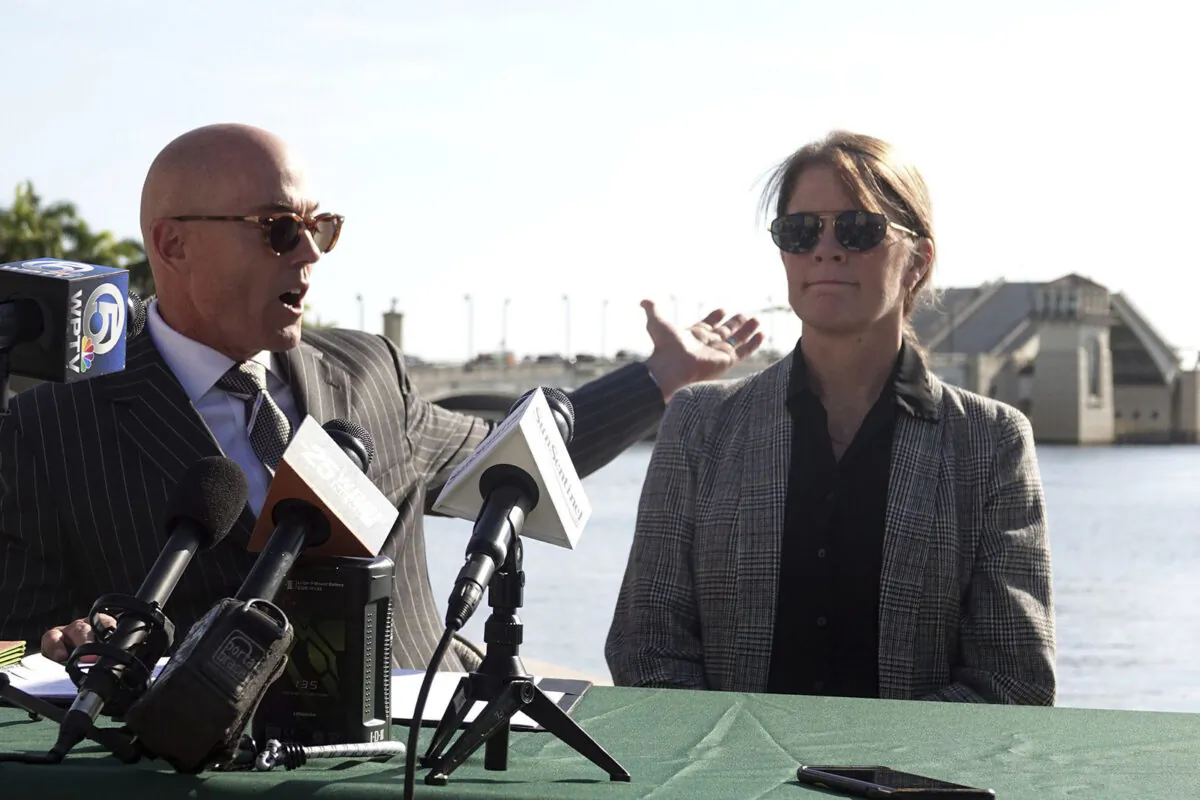 Attorney Lance Ivey (L) speaks with Jill Sanchez, the niece of Carol Wright, during a news conference at the Royal Park Bridge in West Palm Beach, Fla., on March 28, 2022. (Joe Cavaretta/Sun Sentinel/TNS)