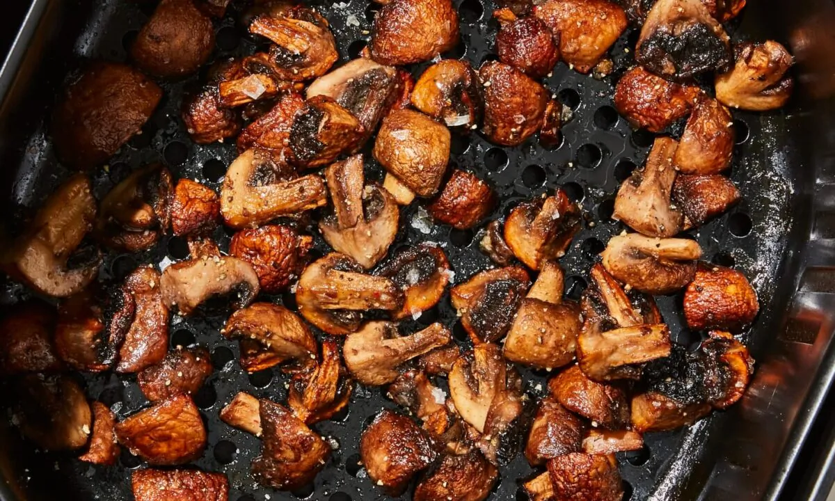 Bite-sized garlic-butter mushrooms are savory with crispy edges, all thanks to the air fryer. (Christopher Testani/TNS)