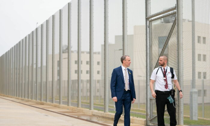 UK Justice Secretary Dominic Raab with a prison officer at the opening of category C prison HMP Five Wells in Wellingborough, United Kingdom, in March 2022. (Joe Giddens/PA)