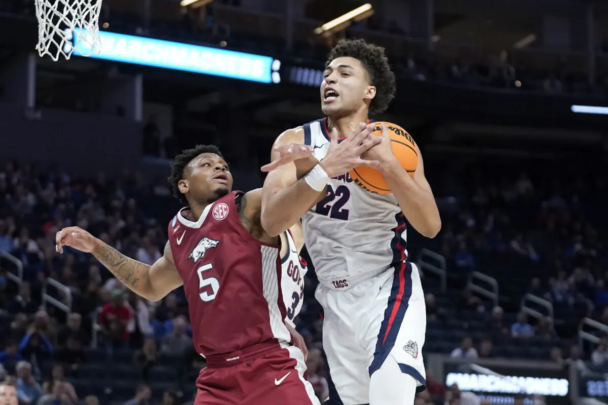 Gonzaga forward Anton Watson (22) grabs a rebound against Arkansas guard Au'Diese Toney (5) during the first half of a college basketball game in San Francisco on March 24, 2022. (Marcio Jose Sanchez/AP Photo)