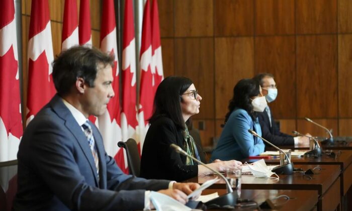 Filomena Tassi, Minister of Public Services and Procurement, along with Anita Anand, Minister of National Defence, and representatives from the federal government hold a press conference in Ottawa on March 28, 2022 (The Canadian Press/Sean Kilpatrick)