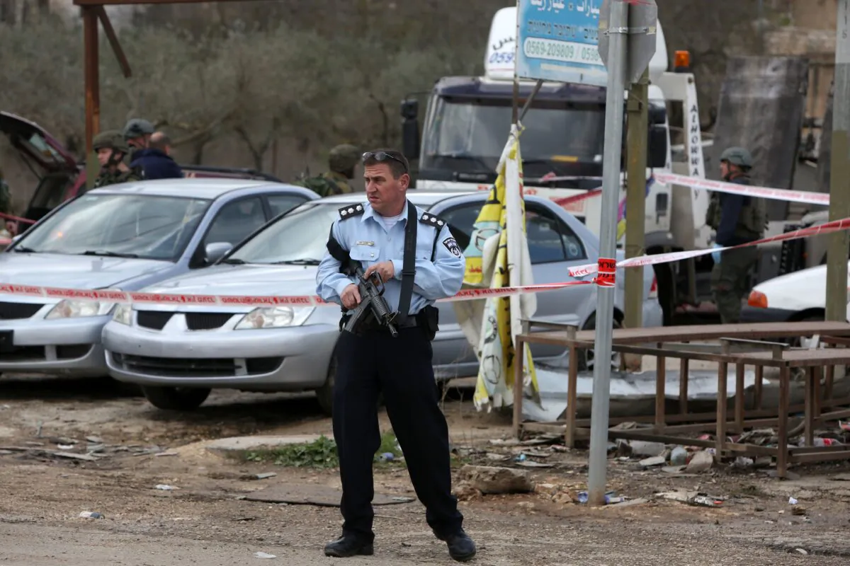 An Israeli policeman stands as guard near the West Bank city of Nablus, Israel, on Dec. 31, 2015. (Jaafar Ashtiyeh/AFP via Getty Images)