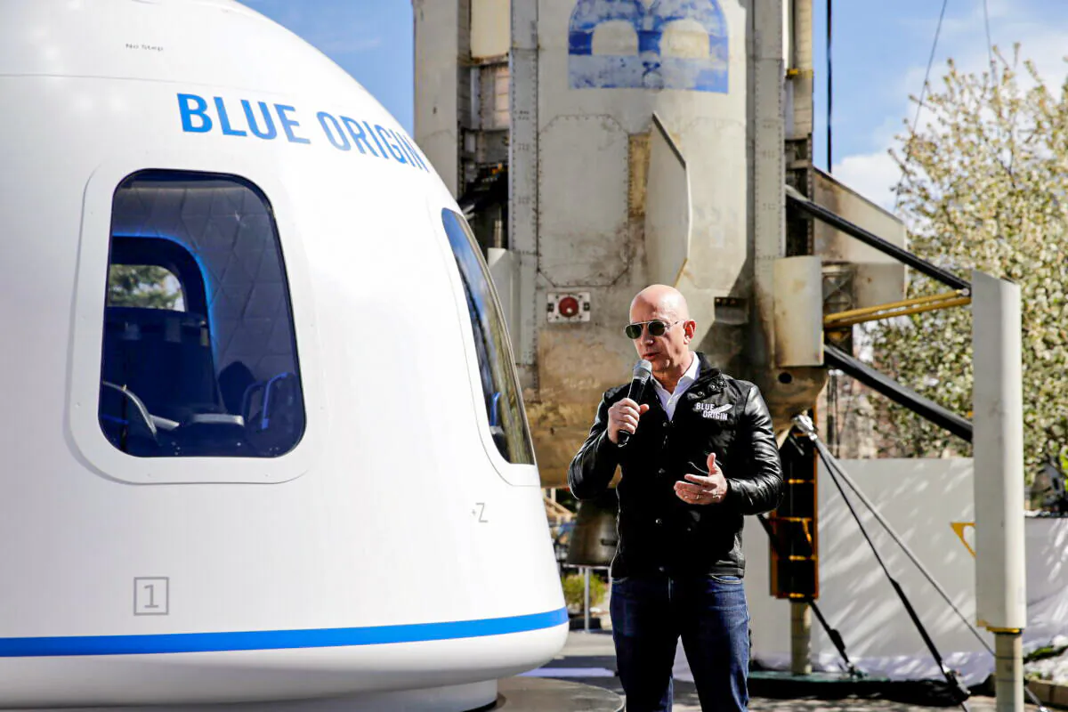 Amazon and Blue Origin founder Jeff Bezos addresses the media about the New Shepard rocket booster and Crew Capsule mockup at the 33rd Space Symposium in Colorado Springs, Colo., on April 5, 2017. (Isaiah J. Downing/Reuters)
