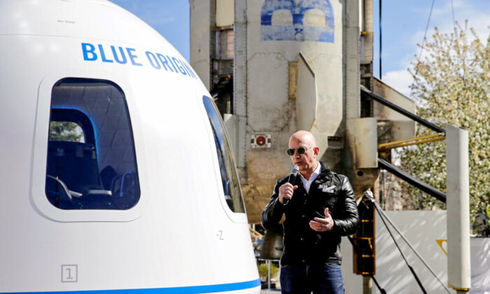 Amazon and Blue Origin founder Jeff Bezos addresses the media about the New Shepard rocket booster and Crew Capsule mockup at the 33rd Space Symposium in Colorado Springs, Colo., on April 5, 2017.  (Isaiah J. Downing/Reuters)