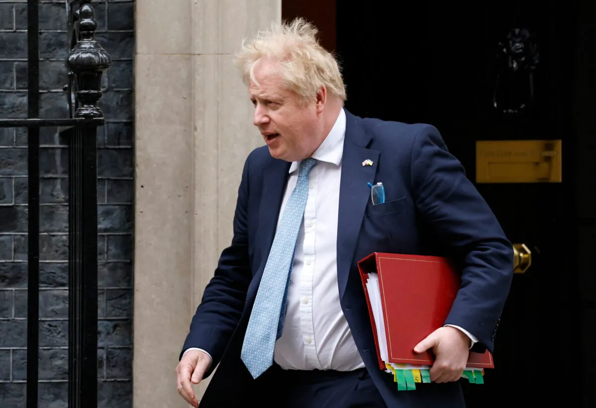 Britain's Prime Minister Boris Johnson leaves from 10 Downing Street to take part in the weekly session of Prime Minister's Questions at the House of Commons, in central London, on March 30, 2022. (Tolga Akmen /AFP via Getty Images)
