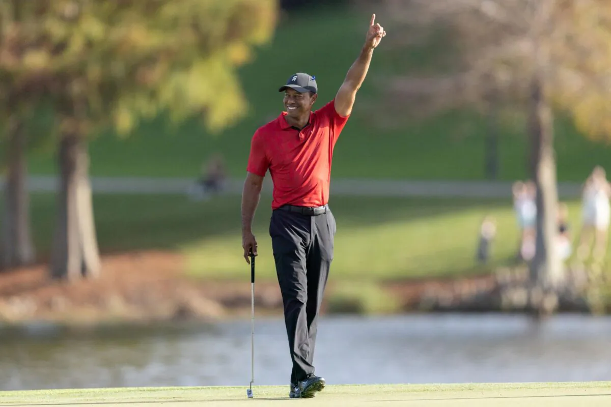 Tiger Woods reacting to Cameron Kuchar draining a long putt on the 17th green during the final round of the PNC Championship golf tournament at Grande Lakes Orlando Course, Orlando, Fla., on Dec 19, 2021. (Jeremy Reper-USA TODAY Sports via Reuters)