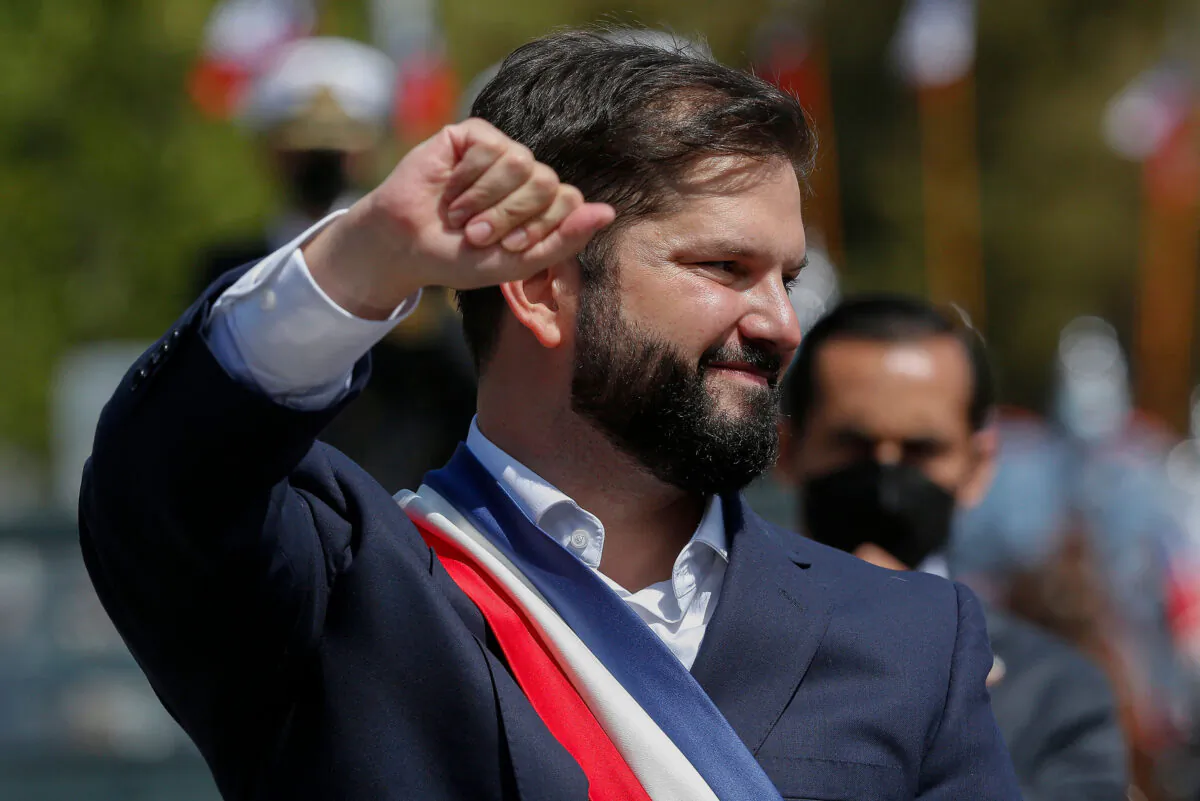 Chile's President Gabriel Boric greets supporters while leaving the Congress after his inauguration ceremony in Valparaíso, Chile, on March 11, 2022. (Claudio Reyes/AFP via Getty Images)