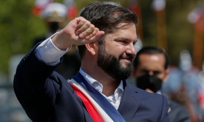 Chile's President Gabriel Boric greets supporters while leaving the Congress after his inauguration ceremony in Valparaíso, Chile, on March 11, 2022. (Claudio Reyes/AFP via Getty Images)