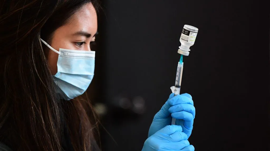 A COVID-19 vaccine is prepared for administration at Union Station in Los Angeles on Jan. 7, 2022. (Frederic J. Brown/AFP via Getty Images)