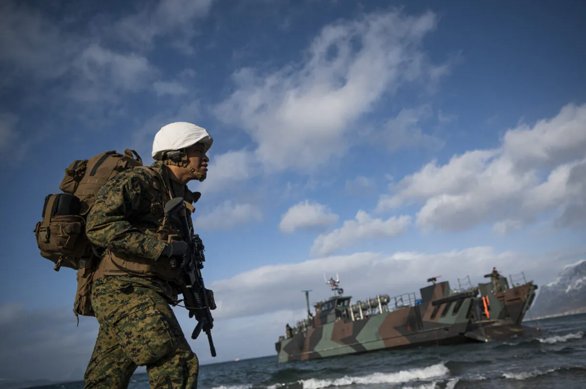 A U.S. soldier from the 3rd Battalion, part of the 6th Marine Regiment, participates in the international military exercise Cold Response 22, at Sandstrand, Norway, on March 21, 2022. (Jonathan Nackstrand/AFP via Getty Images)