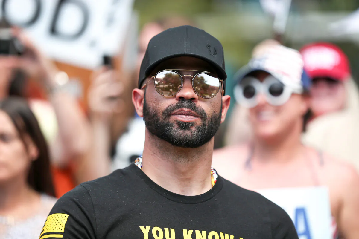 Enrique Tarrio, leader of the Proud Boys, stands outside of the Hyatt Regency, where the Conservative Political Action Conference was being held in Orlando, Fla., on Feb. 27, 2021. (Joe Raedle/Getty Images)