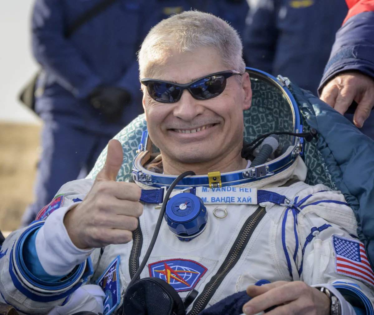 NASA astronaut Mark Vande Hei gives the thumbs up outside the Soyuz MS-19 spacecraft after he landed with Russian cosmonauts Anton Shkaplerov and Pyotr Dubrov in a remote area near the town of Zhezkazgan, Kazakhstan, on March 30, 2022. (Bill Ingall/NASA via AP)