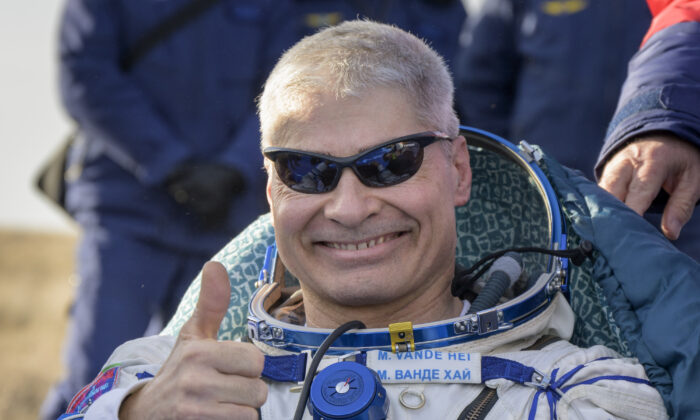 NASA astronaut Mark Vande Hei gives the thumbs up outside the Soyuz MS-19 spacecraft after he landed with Russian cosmonauts Anton Shkaplerov and Pyotr Dubrov in a remote area near the town of Zhezkazgan, Kazakhstan, on March 30, 2022. (Bill Ingall/NASA via AP)