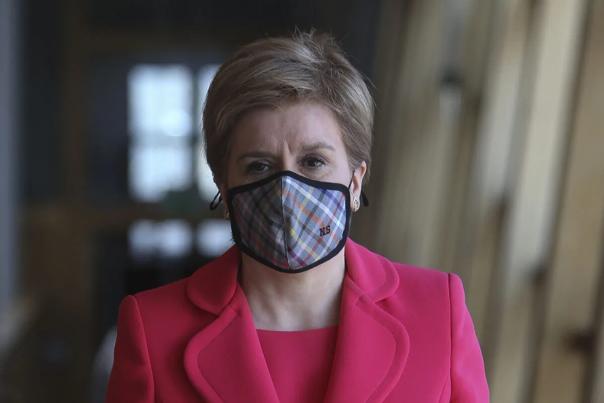 First Minister of Scotland Nicola Sturgeon attends the Scottish Parliament to give updates on changes to COVID-19 restrictions including the wearing of masks, in Edinburgh, Scotland, on March 30, 2022. (Fraser Bremner - Pool/Getty Images)