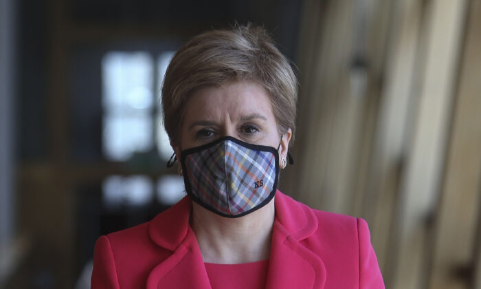 First Minister of Scotland Nicola Sturgeon attends the Scottish Parliament to give updates on changes to COVID-19 restrictions including the wearing of masks, in Edinburgh, Scotland, on March 30, 2022. (Fraser Bremner/Getty Images)