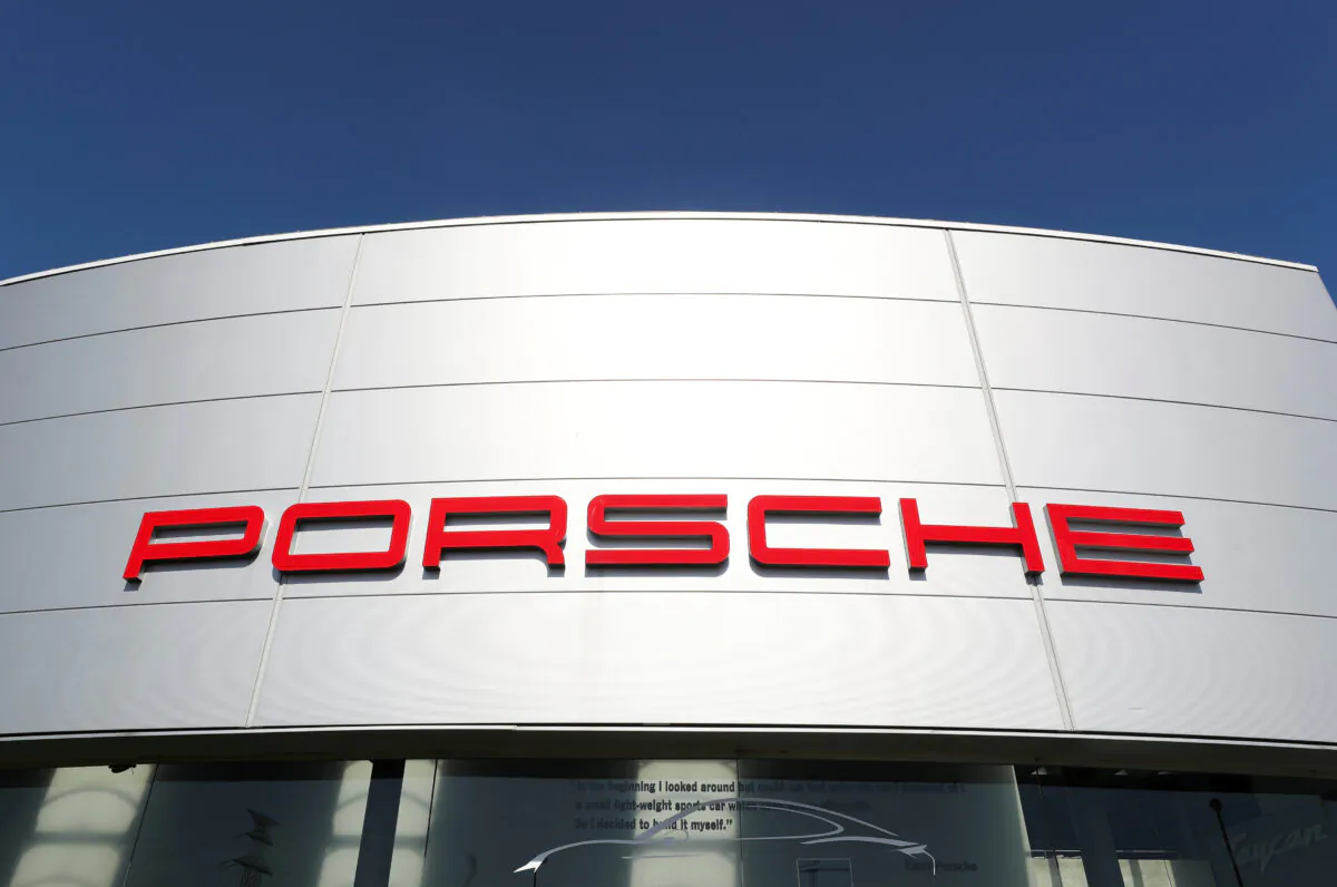 A logo is seen outside of a Porsche car dealer in Brussels on May 28, 2020. (Yves Herman/Reuters)