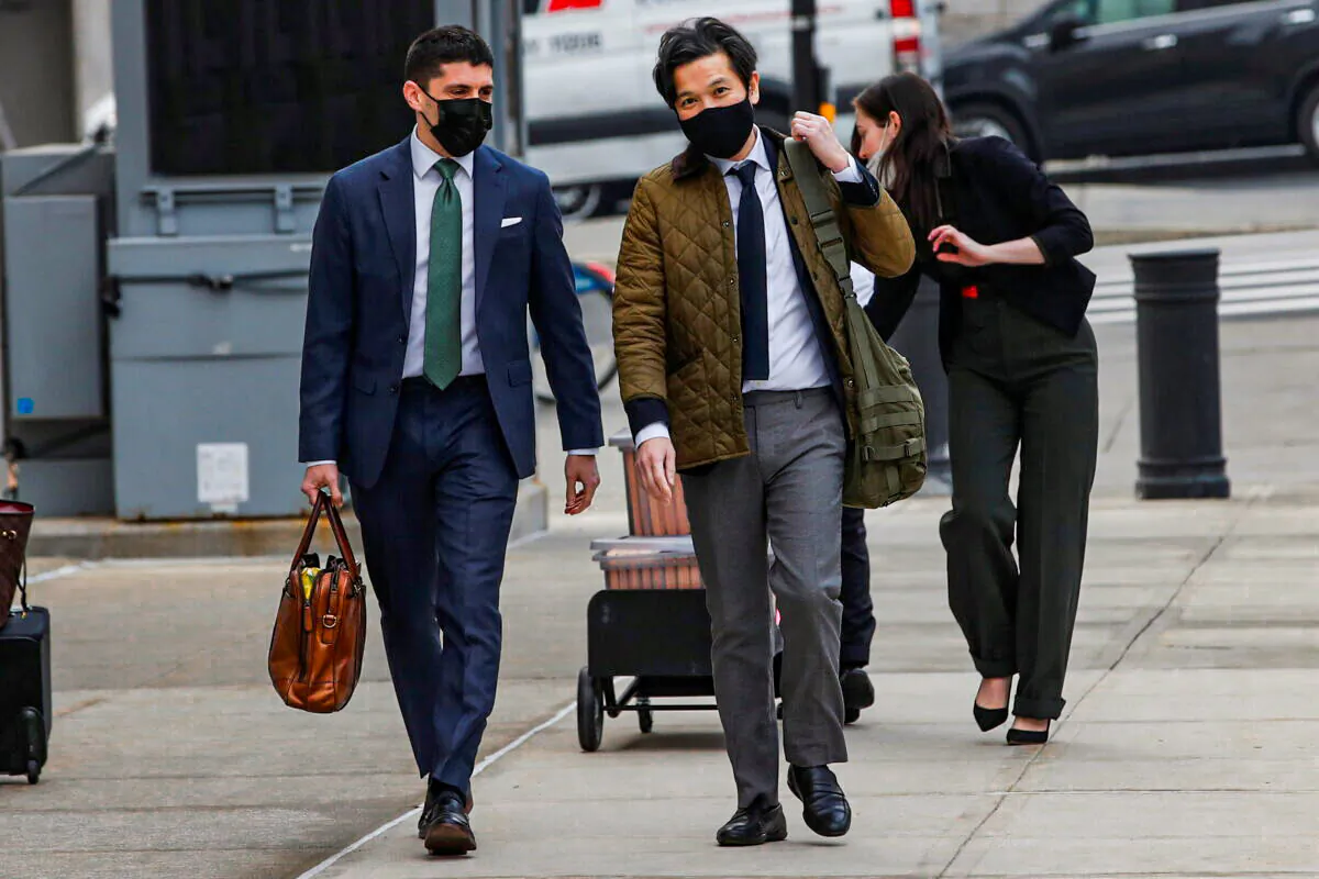 Ex-Goldman Sachs banker Roger Ng (C) arrives for his criminal trial, at the United States Courthouse in Brooklyn, New York, on Feb. 22, 2022. (Eduardo Munoz/Reuters)