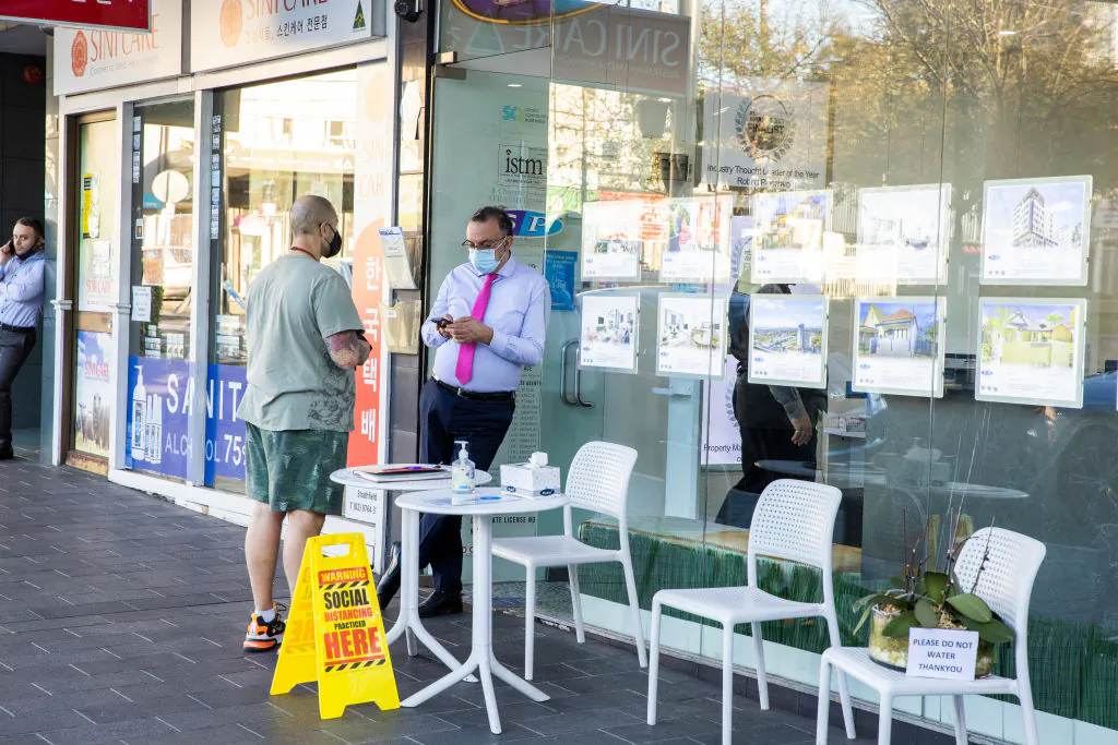 A social distancing sign is seen at a real estate agent shop in Strathfield  in Sydney, Australia, on Aug. 12, 2021. (Jenny Evans/Getty Images)