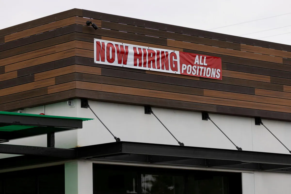 A restaurant advertising jobs looks to attract workers in Oceanside, Calif., on May 10, 2021. Mike Blake/Reuters