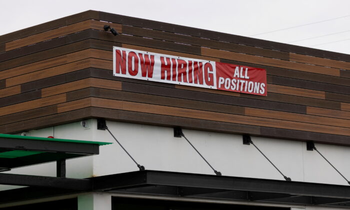 A restaurant advertising jobs looks to attract workers in Oceanside, California, on May 10, 2021. (Mike Blake/Reuters)