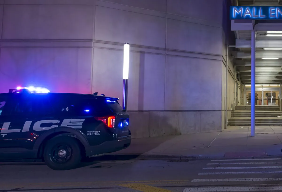 Authorities work the scene outside the Rosemont Outlet Mall in Rosemont, Ill., where a fatal shooting occurred inside, on March 25, 2022. (Tyler Pasciak LaRiviere/Chicago Sun-Times via AP)
