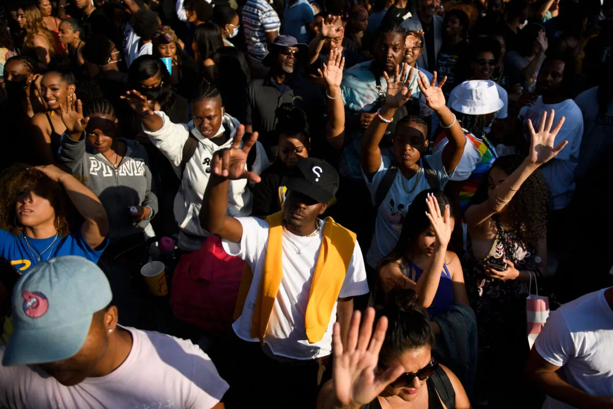 In this file photo, people attend the Leimert Park Rising Juneteenth celebration to mark the end of slavery, in the Leimert Park neighborhood of Los Angeles on June 19, 2021. (Patrick T. Fallon/AFP via Getty Images)