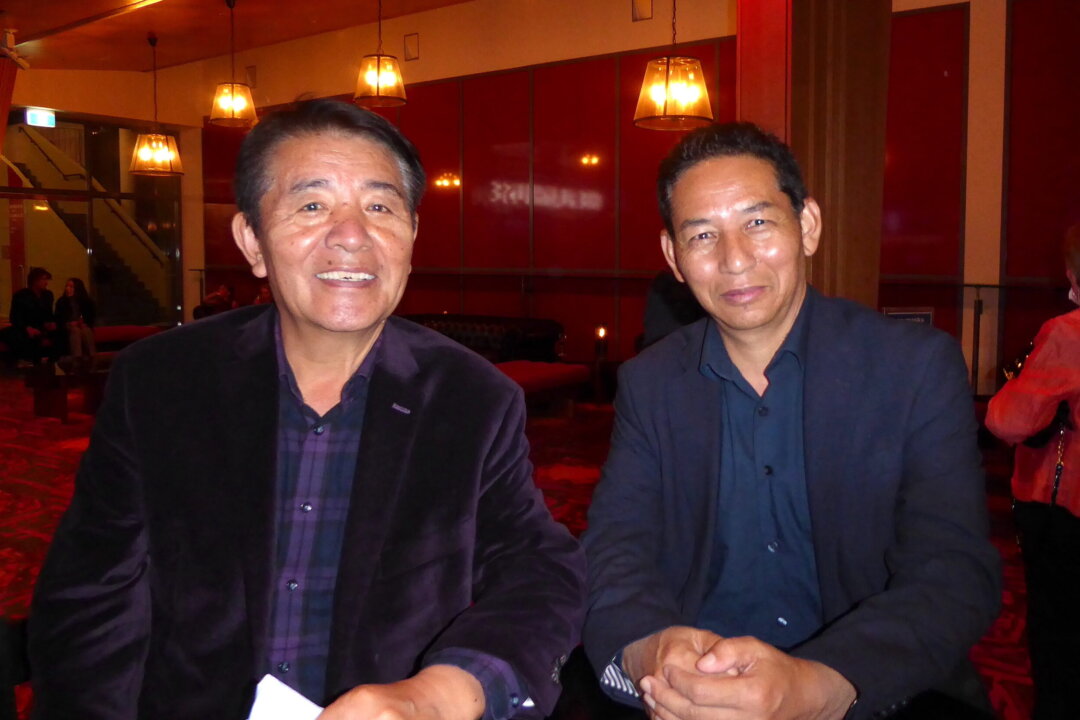 Lhakpa Tshoko, retired Representative of HH the Dalai Lama in Australia (left), and Karma Singey, current Representative of HH the Dalai Lama (right), attend Shen Yun Performing Arts at the Canberra Theatre, Australia, on March 31, 2022. (Steve Xu/The Epoch Times)